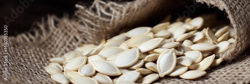 Pumpkin seeds spill out of burlap sack on rustic surface Generative AI
