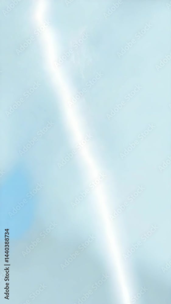 Bright lightning bolt illuminates a cloudy sky during a summer thunderstorm in the afternoon Bright lightning bolt illuminates a cloudy sky during a summer thunderstorm in the afternoon