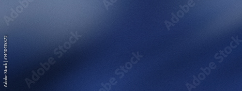 Blurred gradient of blue hues with noise effect, abstract background