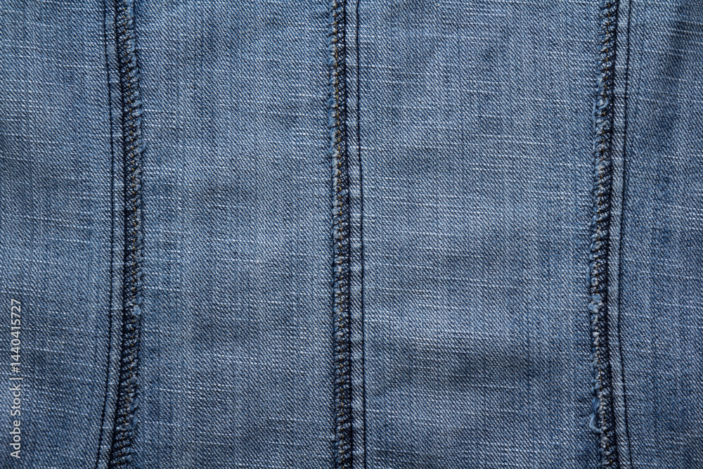 Close-up of overlock seams on the reverse side of denim fabric