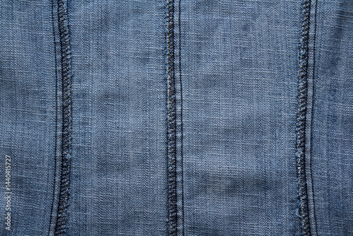 Obraz na płótnie Close-up of overlock seams on the reverse side of denim fabric w salonie