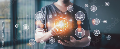 Businessman scans fingerprint on smartphone, surrounded by digital icons of holograms, smart networks, data transfer, and internet systems, symbolizing data archiving and automation.