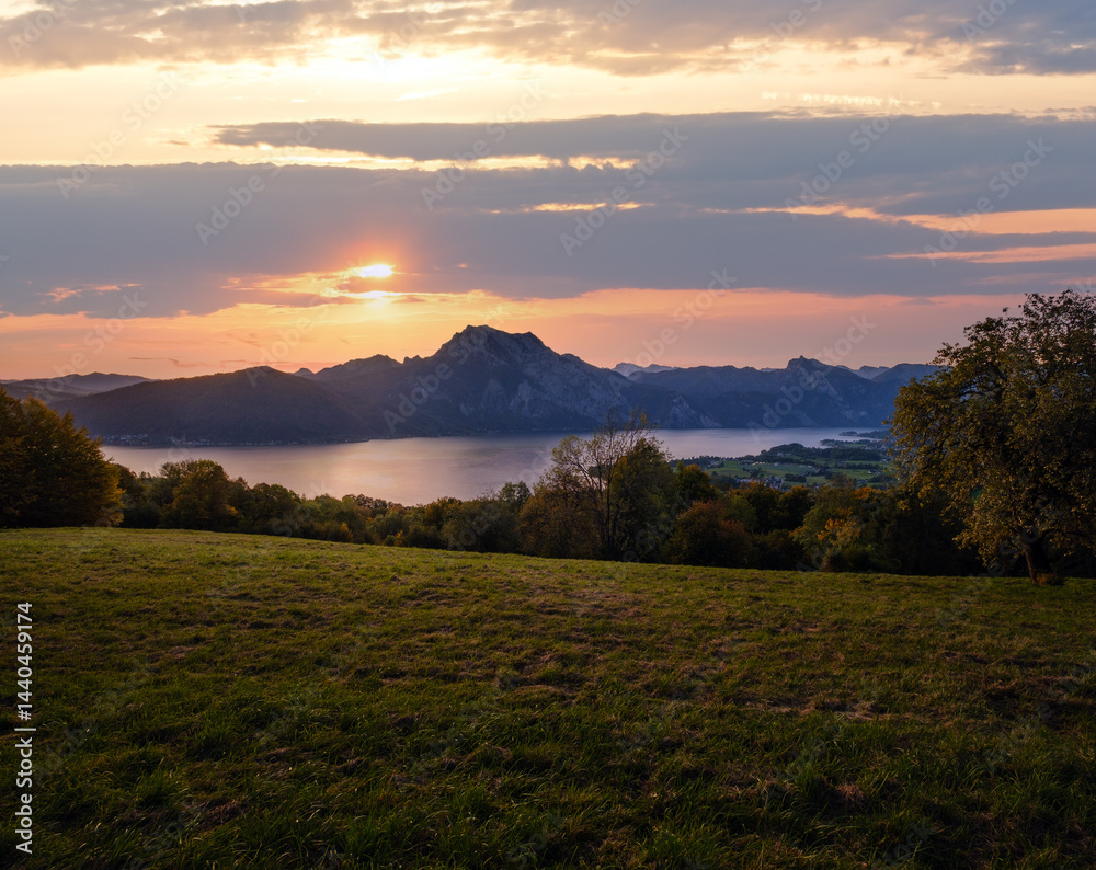 Peaceful autumn Alps mountain lake. Sunrise view to Traunsee lake, Gmundnerberg, Altmunster am Traunsee, Upper Austria.