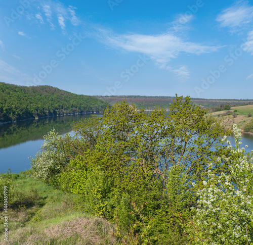 Obraz na płótnie Amazing spring view on the Dnister River Canyon with picturesque rocks, fields, flowers. This place named Shyshkovi Gorby, Nahoriany, Chernivtsi region, Ukraine. w salonie