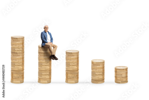 Casual mature man sitting on a pile of coins