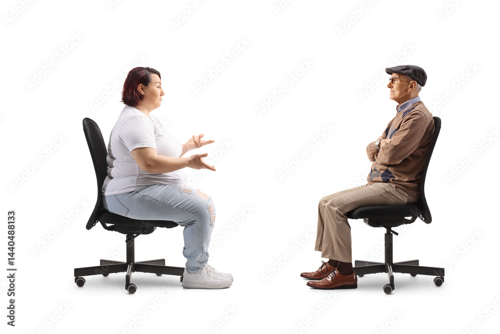 Corpulent woman sitting in an office chair and talking to a senior man Corpulent woman sitting in an office chair and talking to a senior man