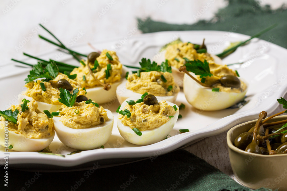 Eggs stuffed with mousse of egg yolk, mayonnaise, mustard and capers.
