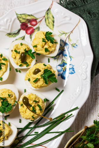 Obraz na płótnie Eggs stuffed with mousse of egg yolk, mayonnaise, mustard and capers. w salonie