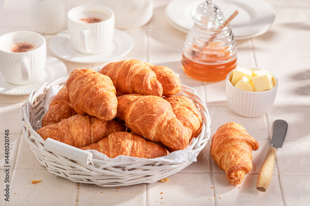 Homemade and fresh french croissants served with coffee.