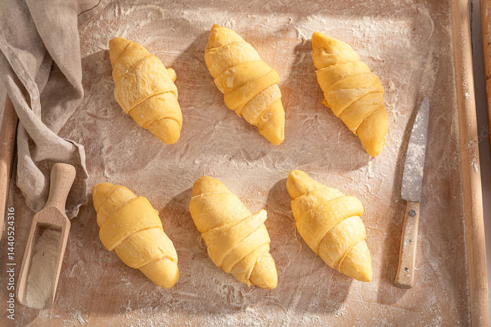 Sweet french croissants preparation for baking in home.