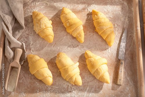 Sweet french croissants preparation for baking in home.