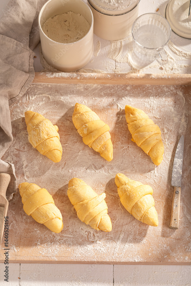 Delicious french croissants preparation before baking in oven.