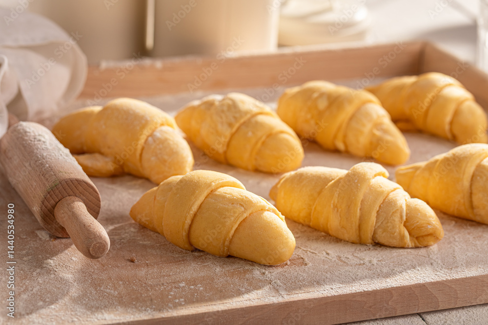 Homemade french croissants made of raw puff pastry.