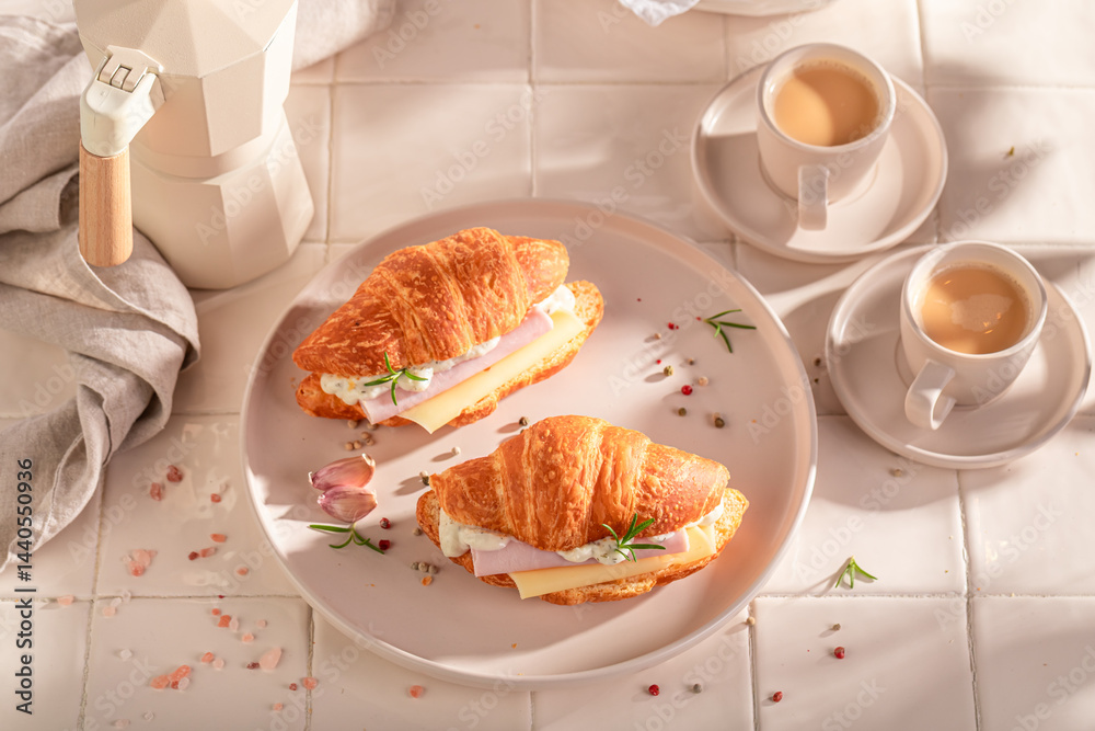 Homemade and hot french croissant as a breakfast sandwich.