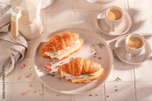 Homemade and hot french croissant as a breakfast sandwich.