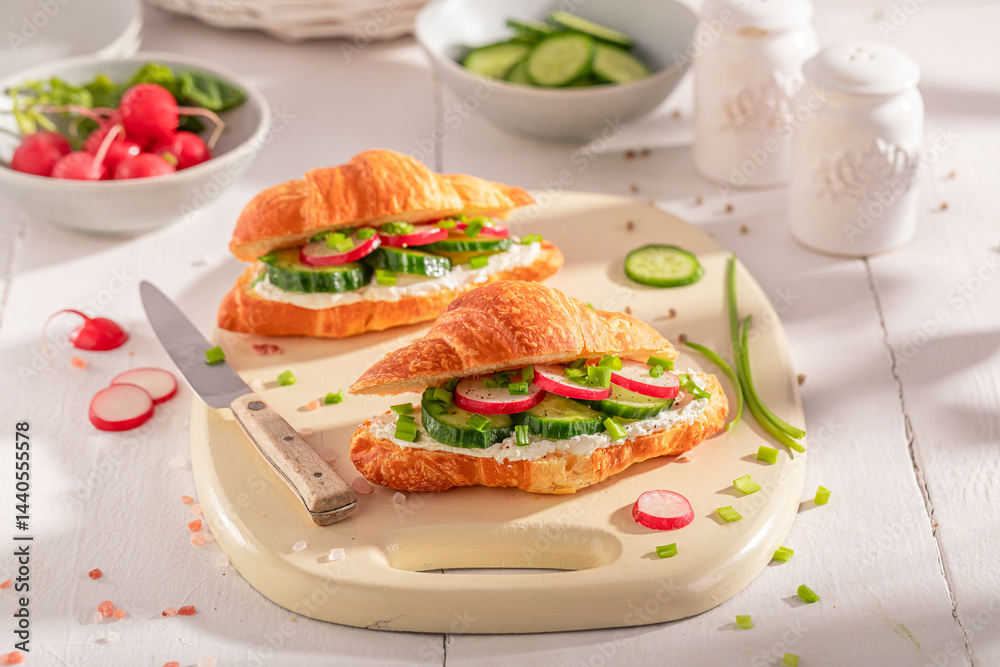 Golden and healthy french croissant with radish and cottage cheese.