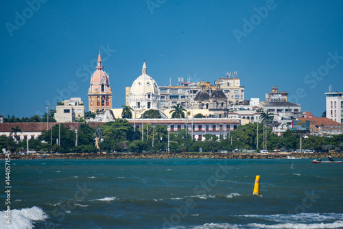 Fototapeta Naklejka Na Ścianę i Meble -  View of the historic Old Town across the Caribbean Sea at the beach in Cartagena, Colombia