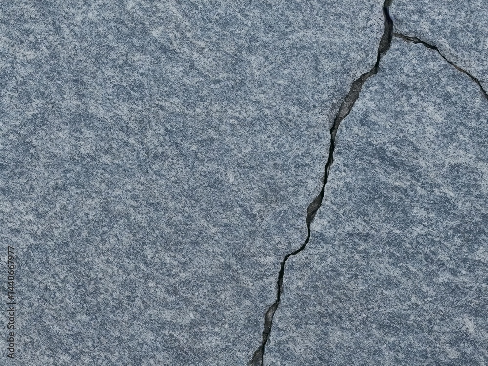 Obraz premium Smooth stone surface with single crack running diagonally Imperfection as beau