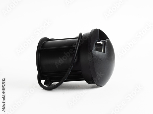 Black Round Inground Outdoor LED Light with Side Openings and Exposed Wires Isolated on White Background

