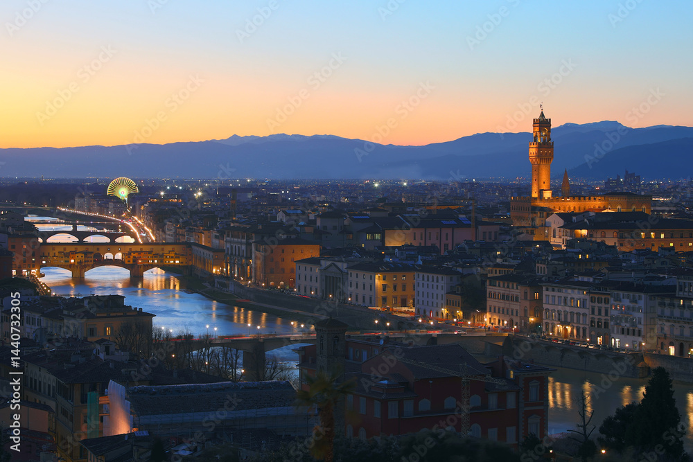 enchanting panoramic view of the city of FLORENCE in central Italy at dusk with the city lights and the ancient monuments illuminated