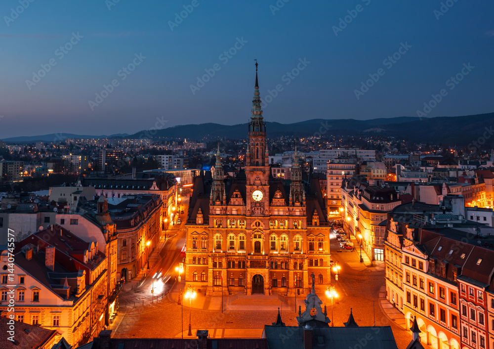 Evening skyline cityscape of Liberec, Czech Republic. Panoramic aerial view of the old town (staré město): main square and city hall at blue hour
