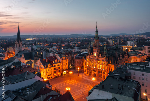 Evening skyline cityscape of Liberec, Czech Republic. Panoramic aerial view of the old town (staré město): main square and city hall at blue hour