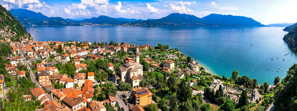Italy, Piedmot region (Piemonte) beautiful Lake Lago Maggiore. scenic village Cassino in Cannero Riviera , border with Switzerland. Aerial panoramic view of lakeside town and mountains