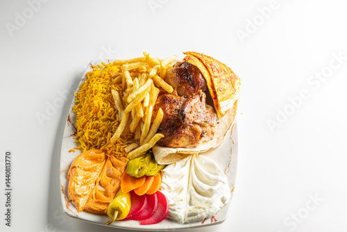 Grilled Chicken Plate with Rice, Fries, Flatbread, and Middle Eastern Appetizers Isolated on White Background

