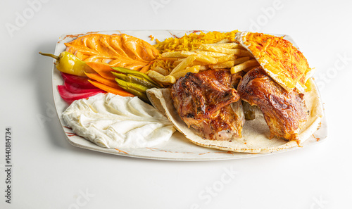 Grilled Chicken Plate with Rice, Fries, Flatbread, and Middle Eastern Appetizers Isolated on White Background

