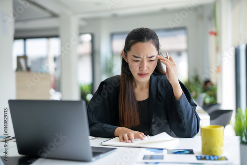 Wallpaper Mural Young professional woman feeling tired and suffering from headache at workplace, massaging temples, exhausted businesswoman having a migraine, overworking or stress Torontodigital.ca