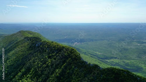 Aerial view of Sisol peak near Brseč, offering stunning views of Učka(Ucka) Nature Park, the Adriatic Sea, and Rijeka city. A beautiful hiking destination on the eastern coast of Istria, Croatia