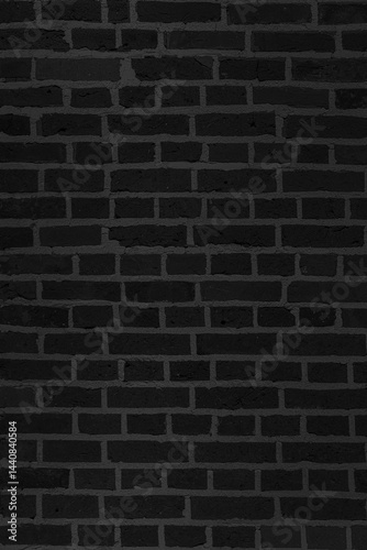 A black brick wall. The wall is made of bricks and has a rough texture.