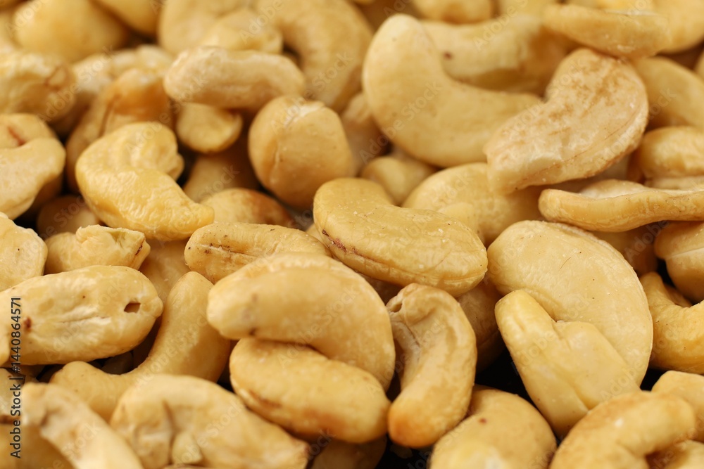 Cashew nuts arranged in a closeup display showcasing their natural color and texture Cashew nuts arranged in a closeup display showcasing their natural color and texture