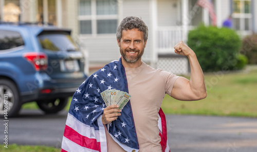 Man with American flag and dollar money. Inflation concept. American tax policy. Hispanic man and USA flag. Paying tax in America. Value added tax. Taxation system. Patriotic strong man