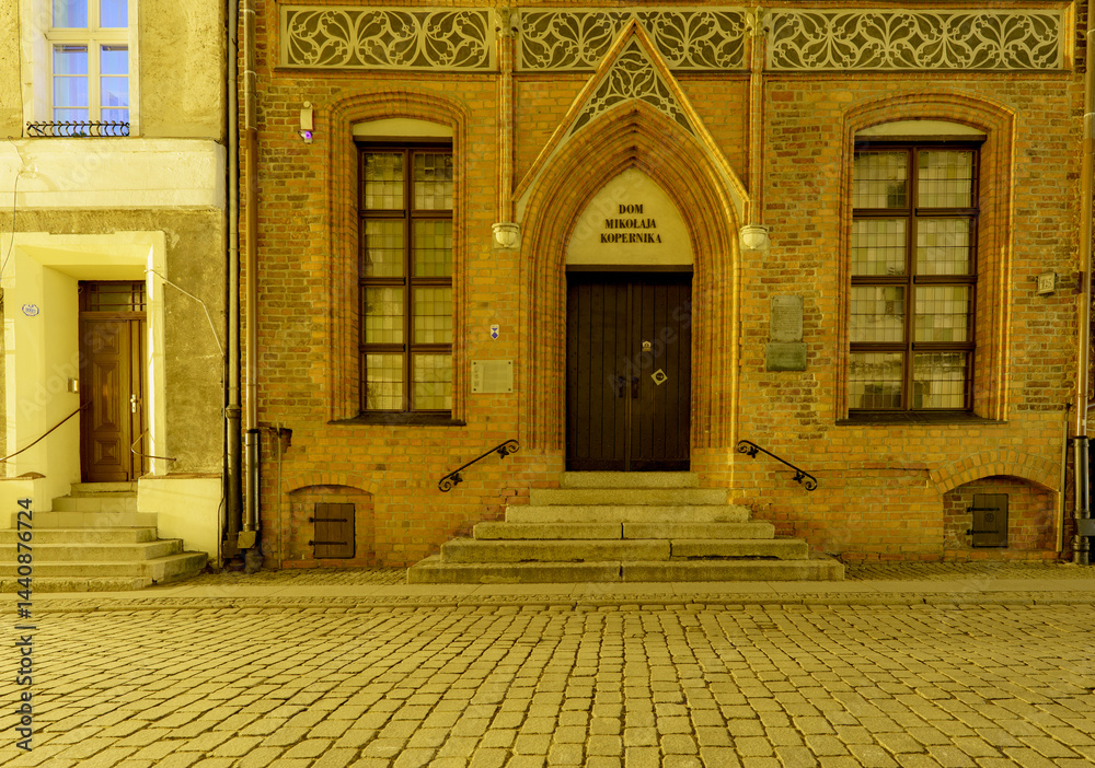 Fototapeta premium Entrance to Nicolaus Copernicus House Museum in Toruń Old Town, Poland..