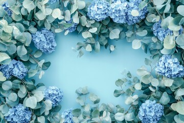 Light blue floral border design with eucalyptus and hydrangeas.