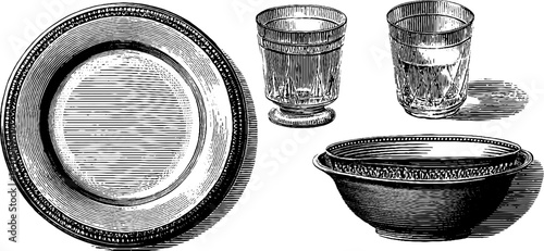 Vintage engraved tableware collection featuring plates, bowls, and glasses