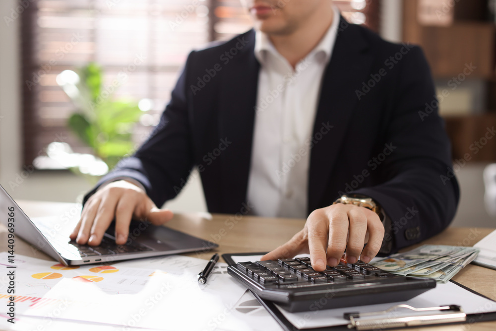 Professional banker working at desk in office, closeup