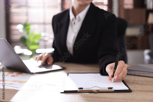 Professional banker working at desk in office, closeup