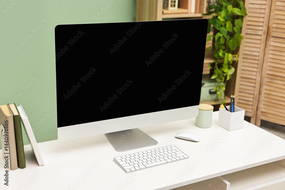Fototapeta premium Comfortable workplace with modern computer and stationery on white table indoors