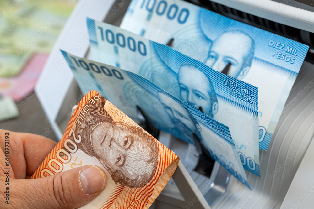 Chilean peso in a money counter. Financial and business concept. 10 and 20 thousand pesos banknotes. Banking, economics, investing in Chile. closeup