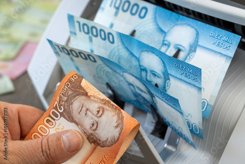 Obraz na płótnie Chilean peso in a money counter. Financial and business concept. 10 and 20 thousand pesos banknotes. Banking, economics, investing in Chile. closeup w salonie