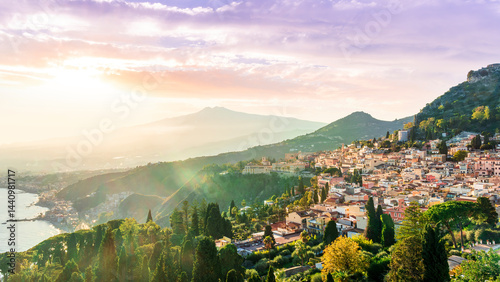 Taormina town, Sicily, Italy. View of Taormina town sunset landscape with mouintain evening beautiful sunset golden light photo