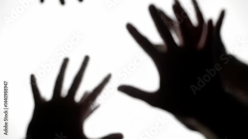 Reaching Hands Silhouettes Gesturing Together on Bright Background