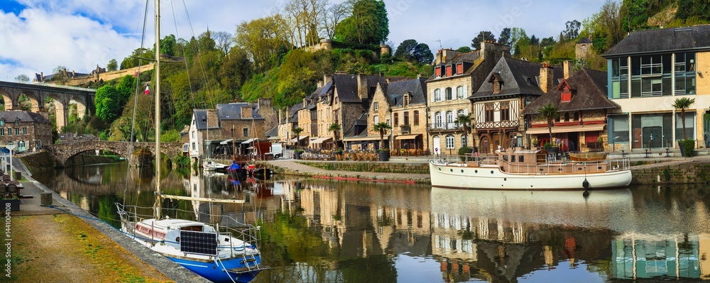 France travel, most scenic villages and towns of Brittany. Picturesque traditional port of Dinan with half-timbered houses, restaurants over canals