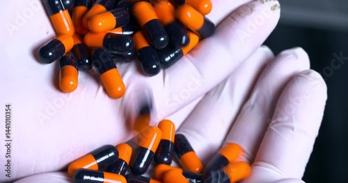 Pharmaceutical Capsule pills tablets being manufactured by a machine. automatic medicine tablet making machine. Production line at a pharmaceutical factory. close up machine medical tablets coming out