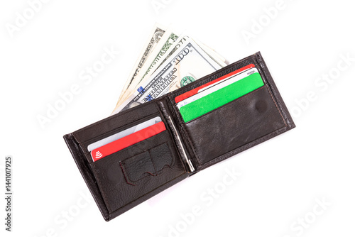 Open men's leather wallet on a white background. Credit cards and dollars in a wallet. View from above.