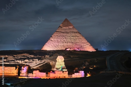 Giza, Egypt - December 24 2023: Sphinx and Pyramid of Khafre (Kefren) on Giza plateau, Cairo at the night lights