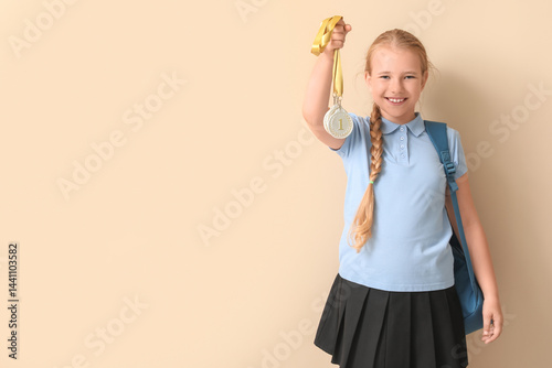Cute little schoolgirl with...