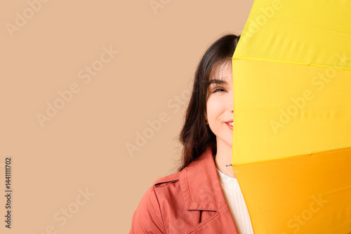 Young woman with opened yel...